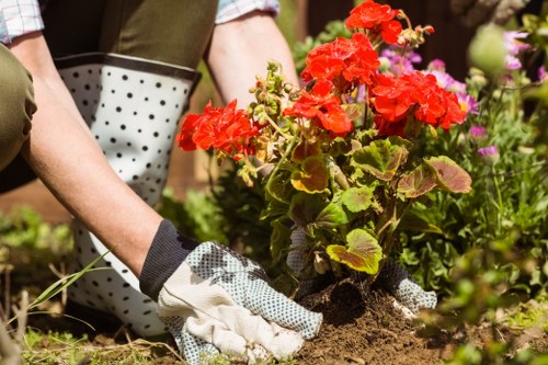 Gardener using essential tools in Blackfriars